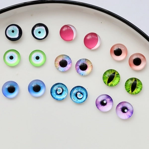 Macro shot of assorted glass evil eye and demon eye cabochons for DIY jewelry making