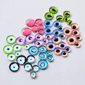 Detailed view of various glass evil eye and demon eye cabochons for DIY jewelry making