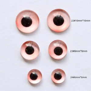 Pink glass doll eyes in 10mm 8mm and 6mm sizes with black pupils and iris texture
