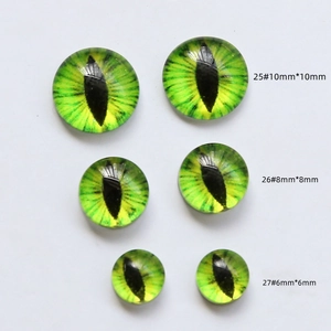 Detailed comparison of green glass dragon eye cabochons in 6mm, 8mm, and 10mm sizes