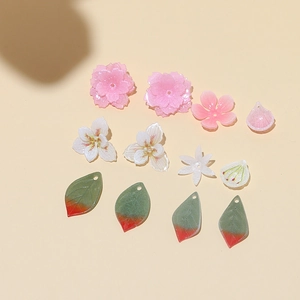 DIY handmade floral jewelry accessories with pink peach blossoms and green leaf charms
