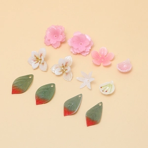 DIY floral jewelry resin accessories including cherry blossom and leaf charms
