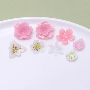 Detailed close-up of mixed resin flower petals and leaves for DIY jewelry making