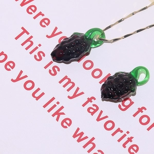 Detailed view of handmade purple grape glass pendant charm with fine golden chain