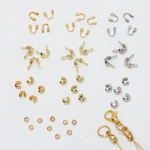 Detailed assortment of 14k gold plated jewelry DIY components including lobster clasps