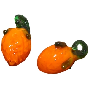 Handmade orange pumpkin glass charm pendant for DIY jewelry making and craft projects