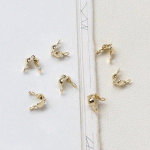 Close-up of 14K gold plated C-shape jewelry clasps for DIY necklace making