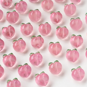 Pink resin peach charms for DIY handmade earrings and hair accessories on white background