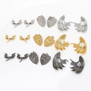 Detailed set of gothic bat, dragon wings and shield ear studs in gold, silver and gun black