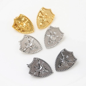 Set of shield-shaped metal earrings with stag head relief in gold, silver, and gunmetal