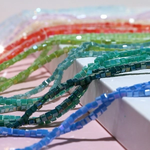 Macro shot of 3mm colorful aurora cube glass beads for DIY jewelry making