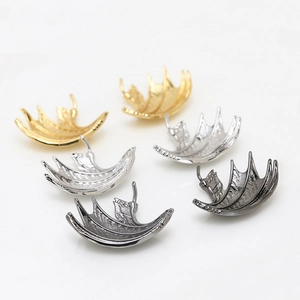 Detailed view of dragon wing metal charms in gold, silver and black for DIY jewelry making