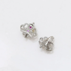 Close-up of crown earrings in silver finish with pink zircon stones for DIY jewelry