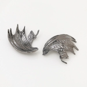 Detailed close-up of dark grey gothic metal dragon wing DIY jewelry accessories