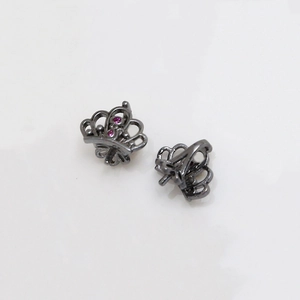 Close-up of black crown charm with pink crystals and petal base for DIY pearl pins