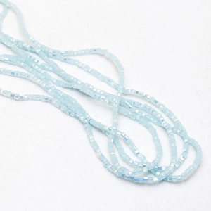 Macro shot of 3mm light blue cubic crystal beads with colorful AB finish for DIY jewelry