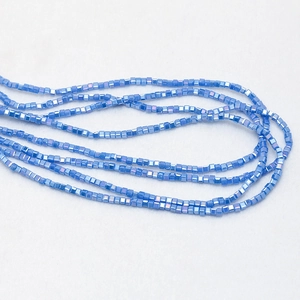 Detailed view of 3mm light blue iridescent cube crystal beads for DIY jewelry making