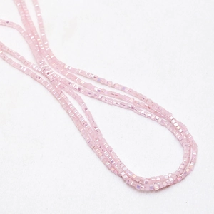 Macro shot of 3mm light pink cube crystals with AB coating for DIY jewelry making