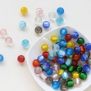 Macro shot of colorful vintage glass beads with gold specks for DIY jewelry making