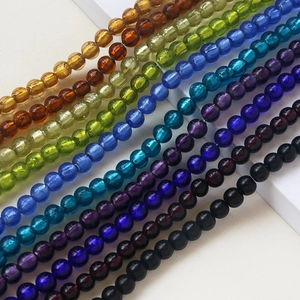 Macro view of colorful crystal glass round beads for DIY jewelry and bracelet making