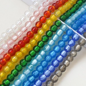 Detailed view of colorful crackle glass beads in various shades for DIY jewelry making
