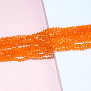 Detail of 4mm bright orange faceted crystal beads for DIY jewelry making and crafts