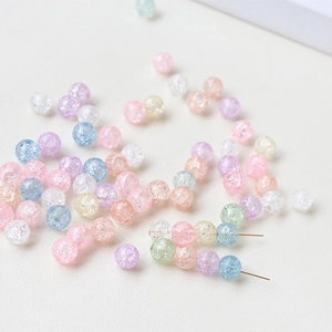Macro shot of macaron colored crackle glass beads for DIY jewelry making and crafts
