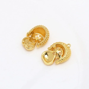 Macro detail of gold-plated Baroque pearl pendant tray settings for DIY jewelry making