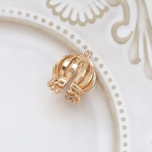 Macro view of gold-plated hollow bead cap pendant for DIY earring jewelry making