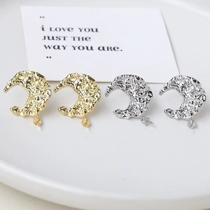 925 sterling silver moon shaped stud earrings with hammered gold and silver texture