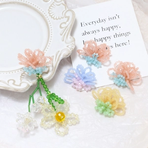 Handmade beaded floral jewelry set with long dangle earrings and multi-colored flower charms