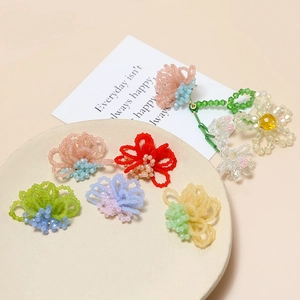 Handmade beaded flower jewelry charms in various colors for DIY earring craft projects