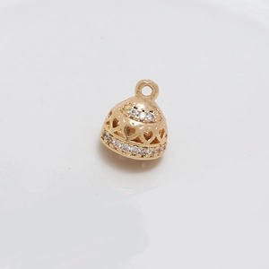 Macro view of gold-plated hollow heart charm with embedded cubic zirconia for DIY jewelry
