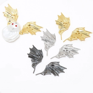Detail of metal dragon wing DIY accessories in gold and silver for jewelry making