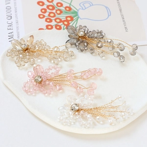 Handmade crystal beaded flower hair clips in champagne, grey, pink, and white finishes