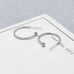 Detailed view of S925 sterling silver C-shaped hoop earrings with polished ball ends
