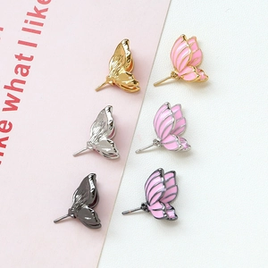 Handmade gold-plated butterfly ear studs with pink enamel and baroque pearl details