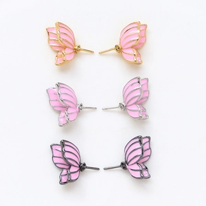 Pink enamel butterfly wing stud earrings in gold, silver, and black metal finishes