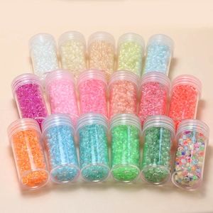 Macro shot of 17 bottles with 4mm macaron glass seed beads for DIY jewelry making