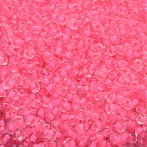 Macro shot of 4mm macaron pink core glass seed beads for DIY jewelry making accessories
