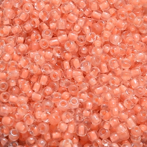 Macro shot of 4mm macaron orange core seed beads for DIY jewelry making and crafts