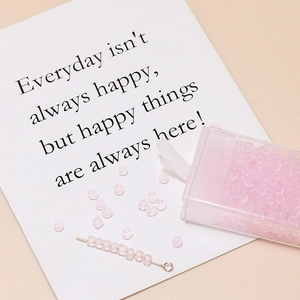Detail of 3mm matte pink beads with storage box and crafting needle for jewelry DIY