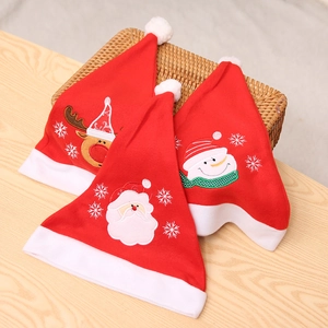 Detail of Christmas hats featuring Santa, snowman and reindeer with plush textures