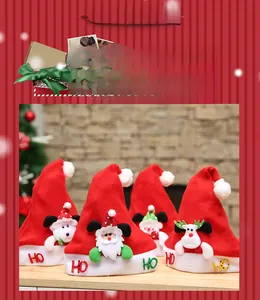Detail of four Christmas wine bottle covers with cartoon appliques and white pom poms