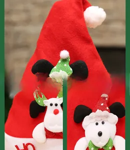 Detail shots of festive kids' Christmas hat with red felt and cute cartoon characters