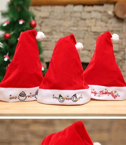 Detailed view of red velvet Christmas hats with Santa, Snowman and Merry Christmas embroidery