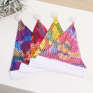 Detail of colorful sequined Christmas hats with white faux fur trim and plush pom-poms