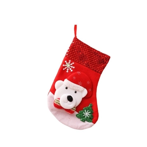 Classic red Christmas stocking with polar bear, sequins, and hanging loop for holiday decor