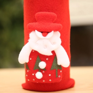Detailed view of the 3D Santa Claus figure on a red felt Christmas wine bottle cover