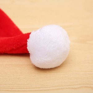 Thick plush Christmas hat featuring a soft white faux fur pompom and red velvet fabric